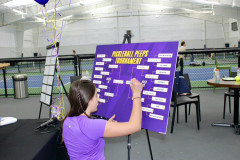 Student Ambassador Reese setting up the pickleball bracket. 